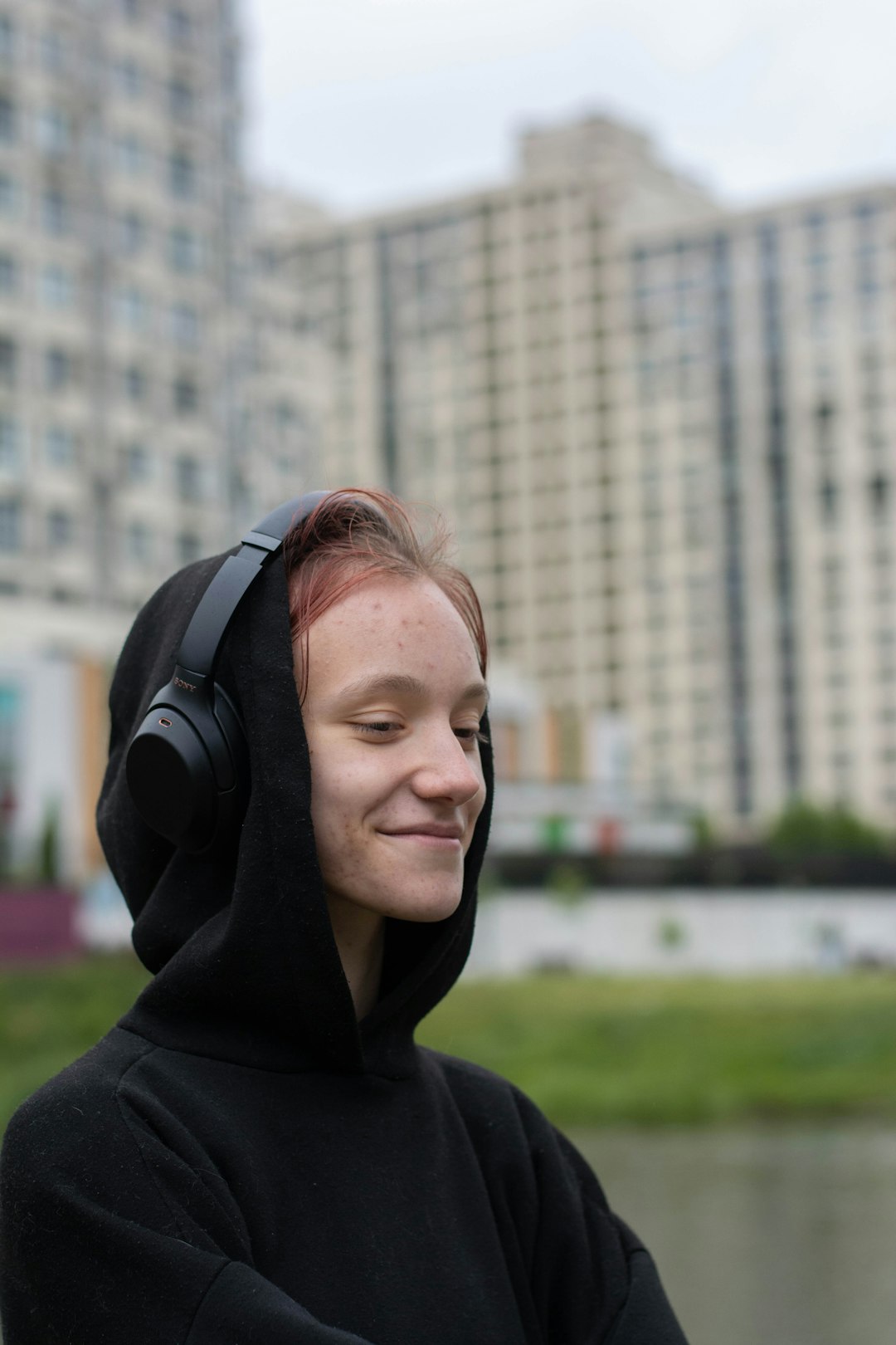 unsplash woman smiling and listening to happy music on headphones rdfwoxxyprs